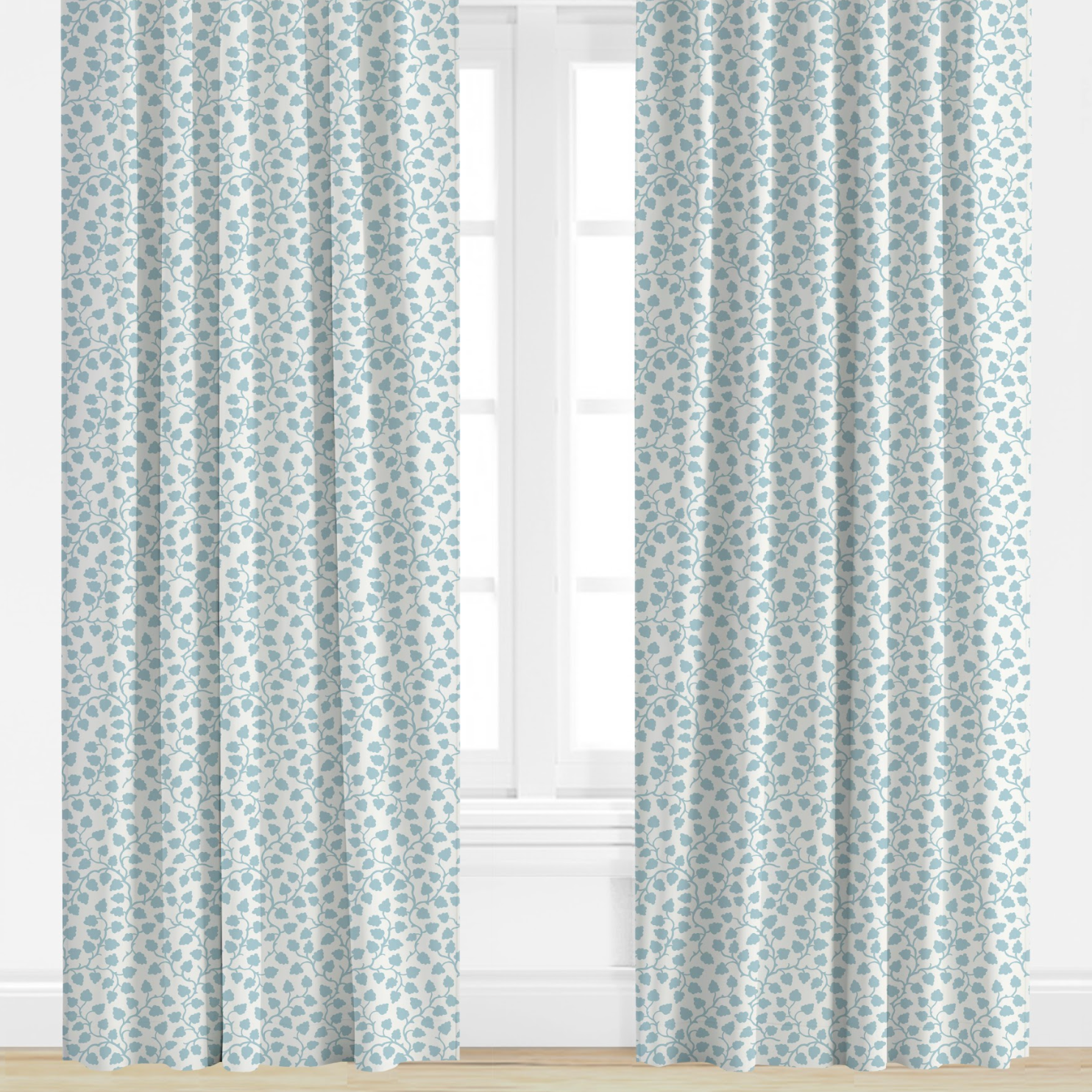 Blue Patterned curtains on a window with a light background
