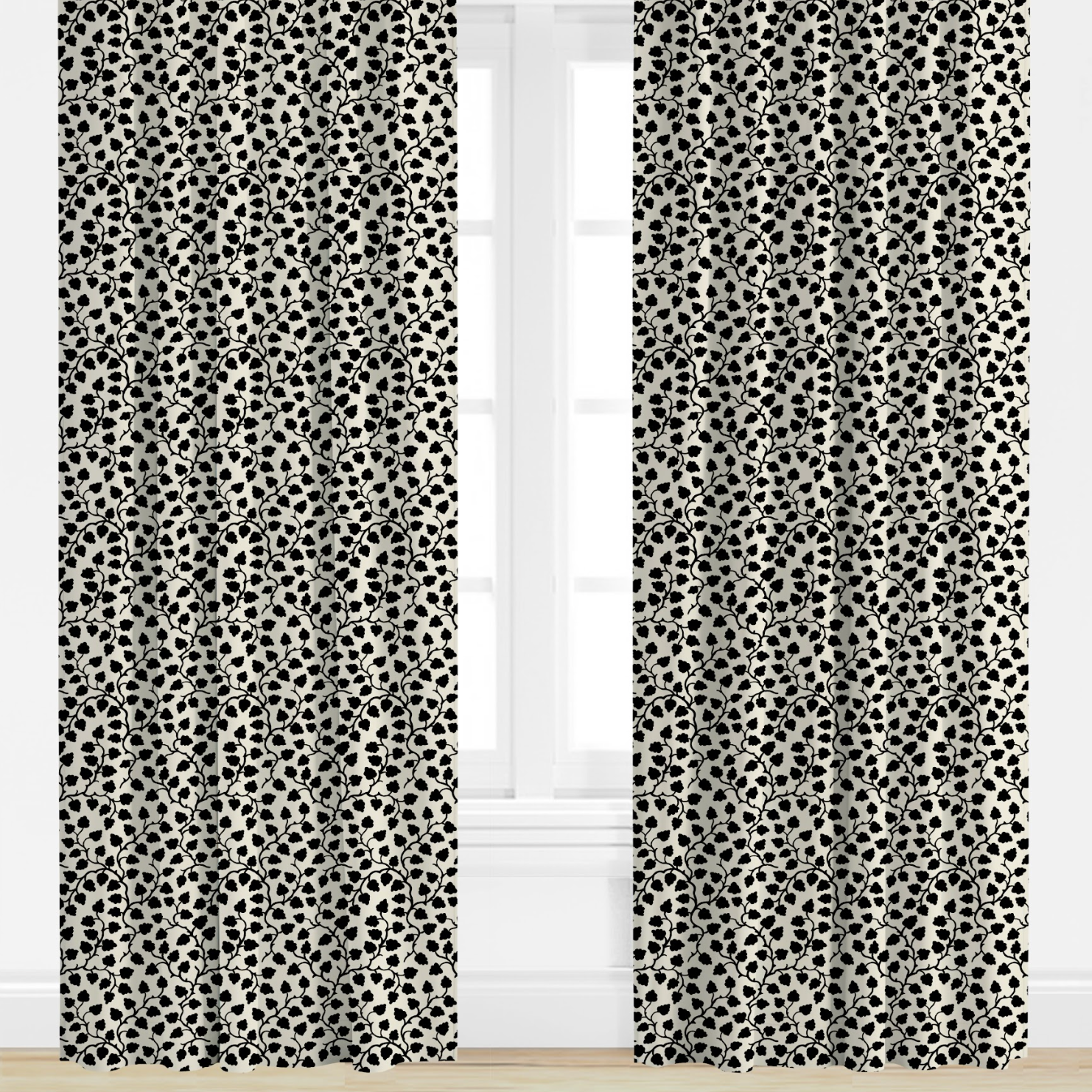 Black and white patterned curtains on a window with a white background