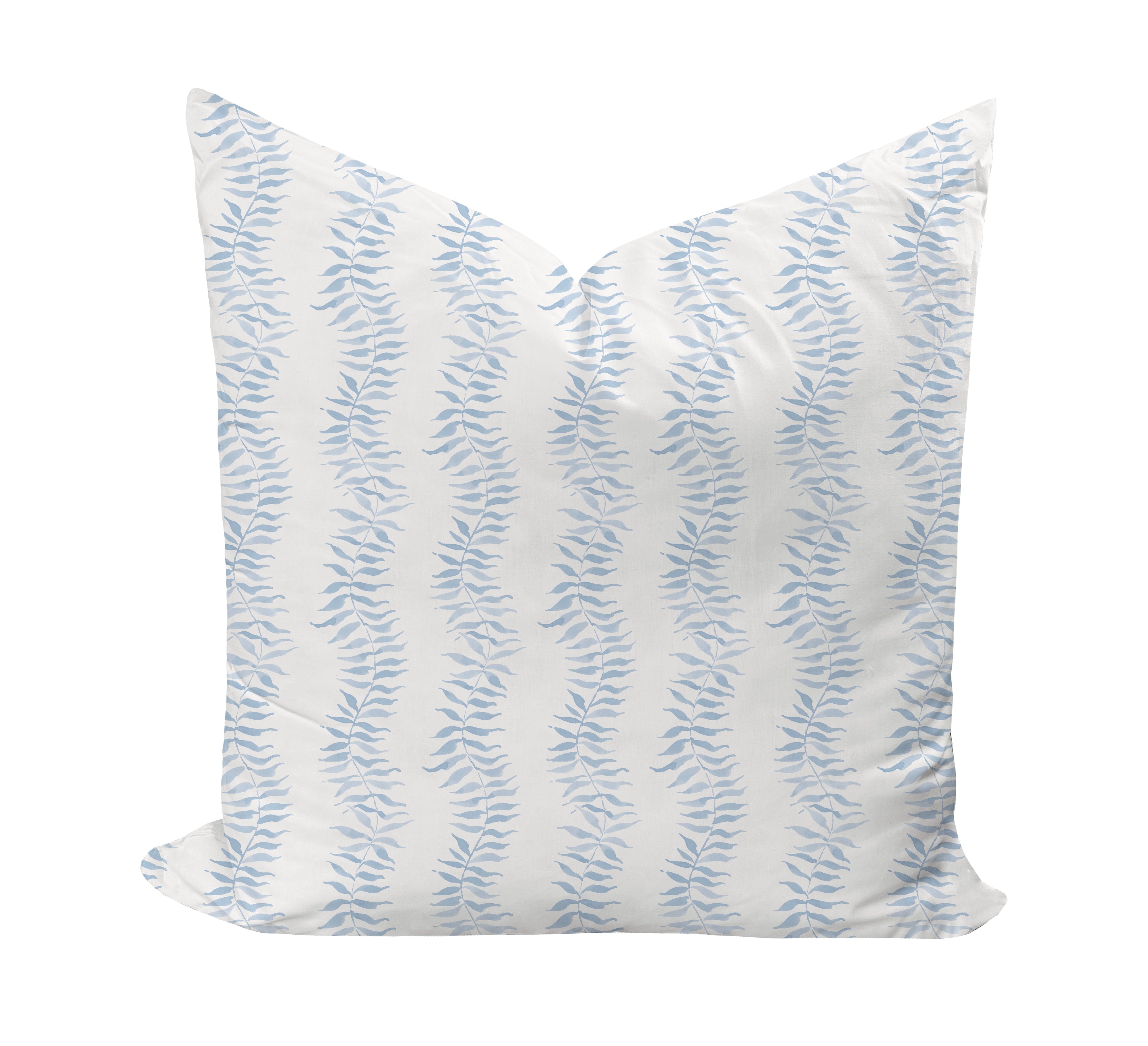Decorative pillow with blue leaf pattern on a white background