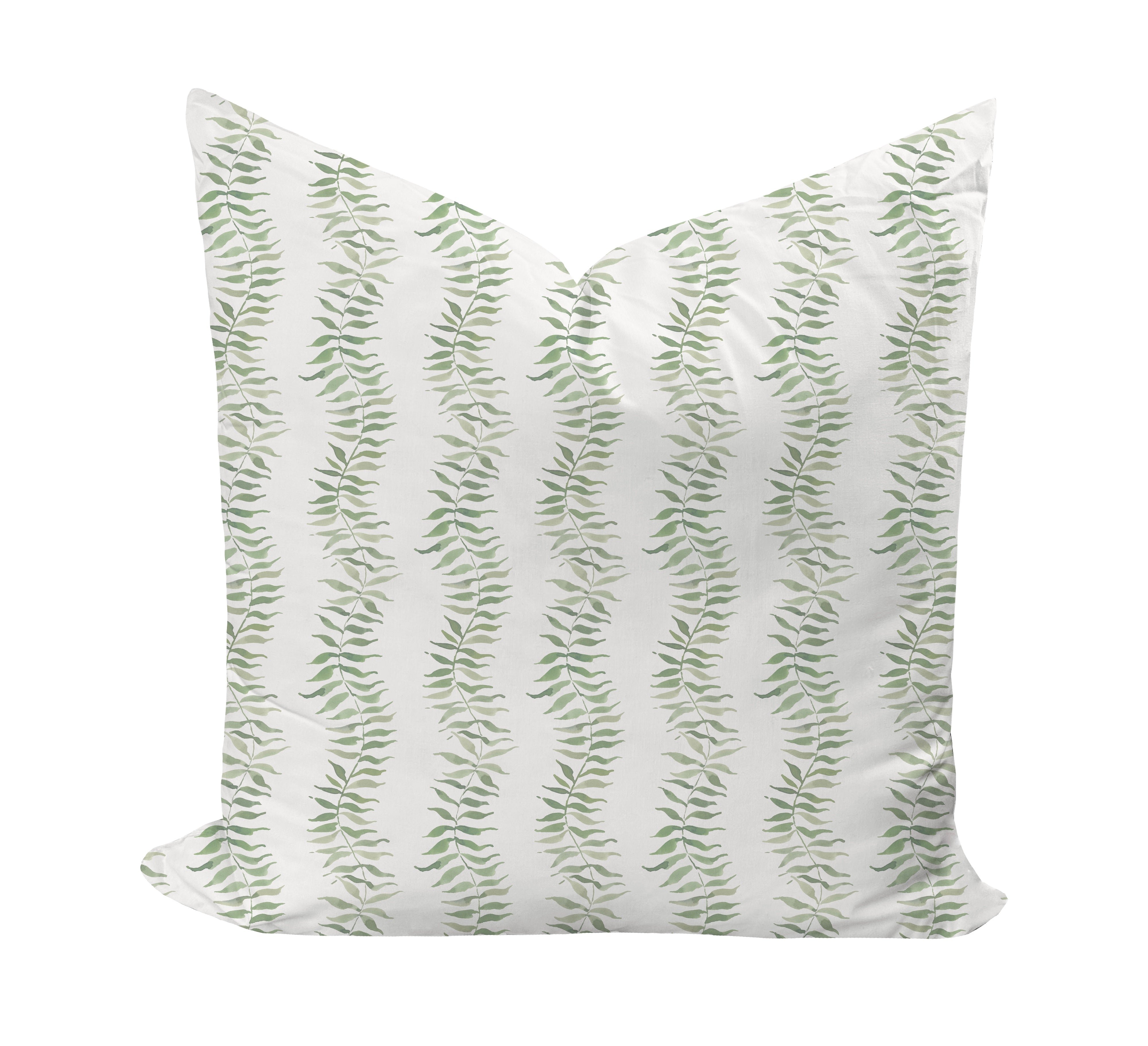 Decorative pillow with green leaf pattern on a white background
