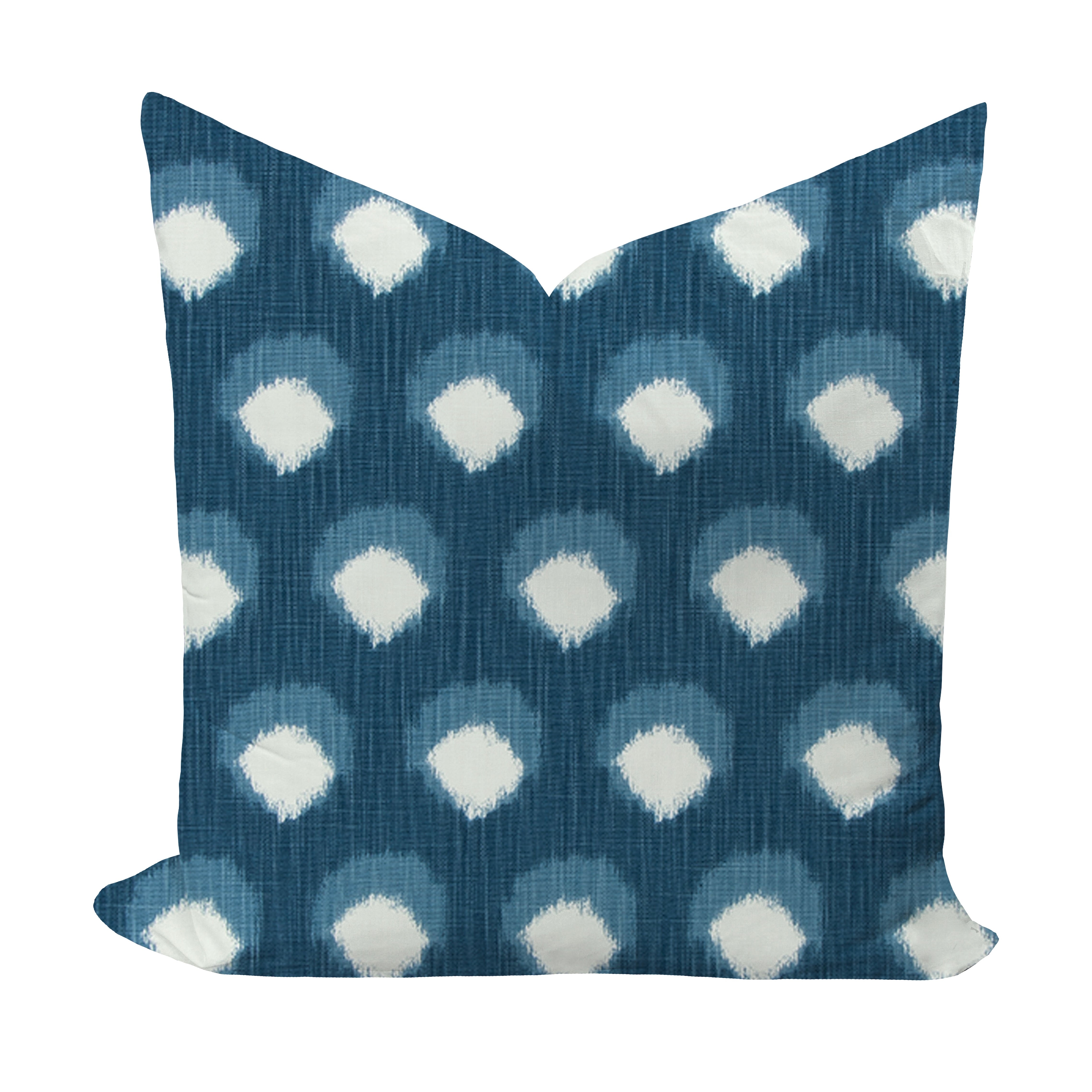 Decorative pillow with blue and white polka dot pattern on a white background
