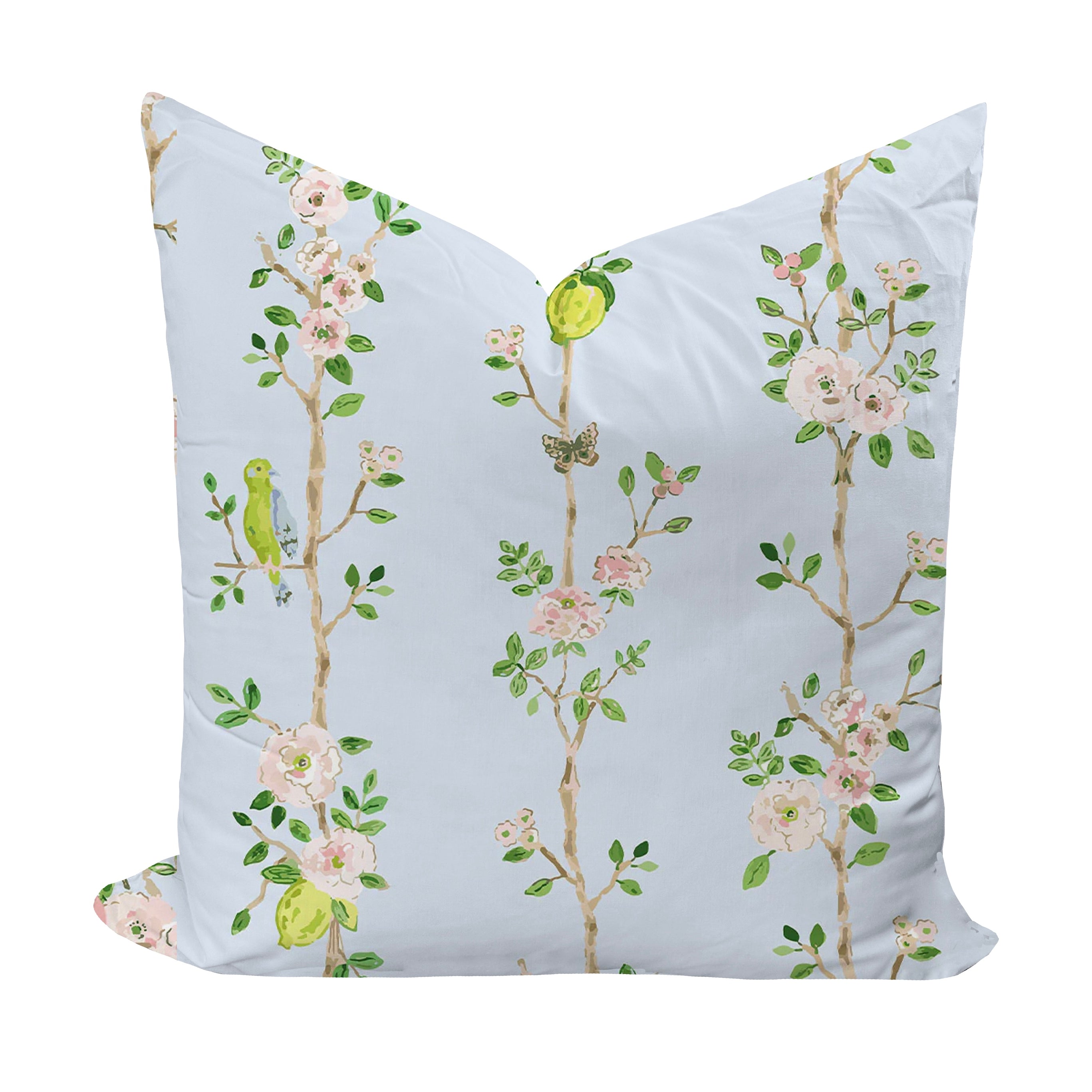 Decorative pillow with floral and bird pattern on a light blue background
