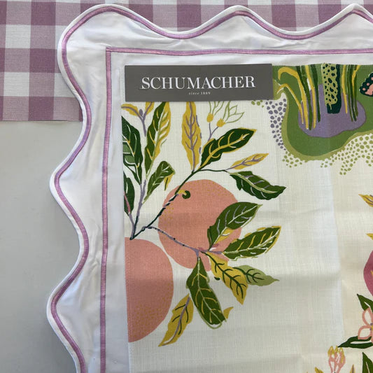 Schumacher fabric swatch with floral design on a checkered background