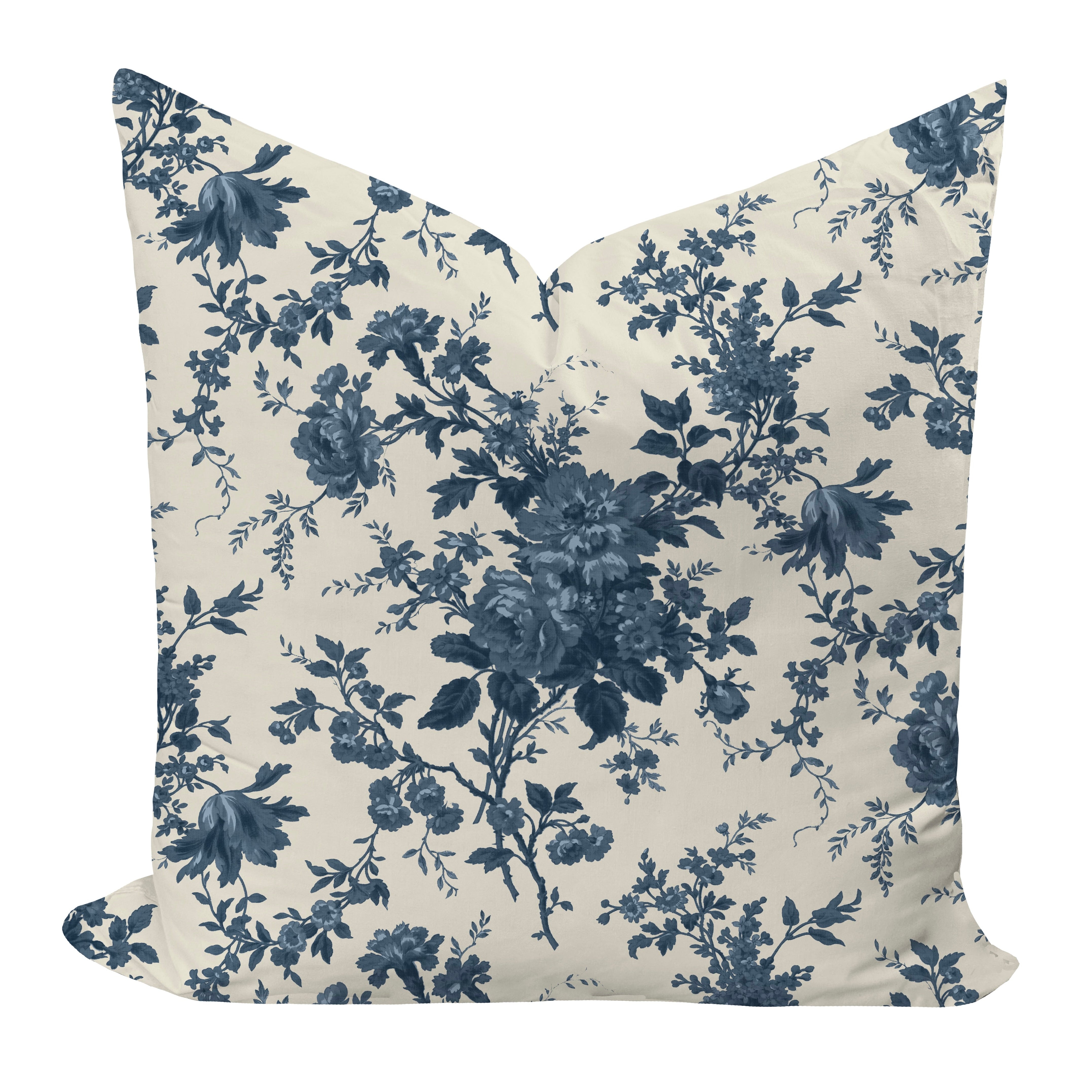 Floral patterned pillow with blue flowers on a beige background