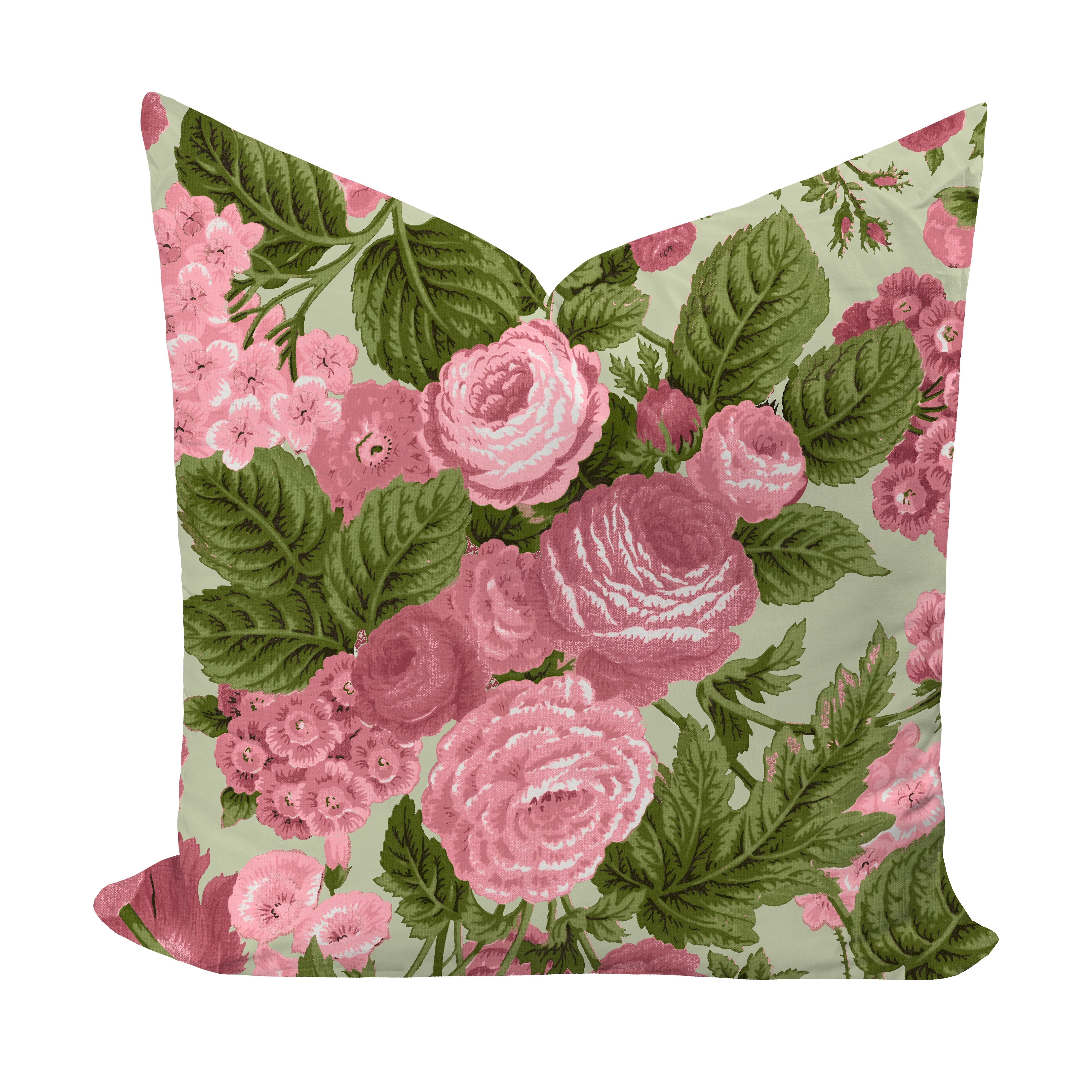 Floral pillow with pink roses and green leaves on a light background