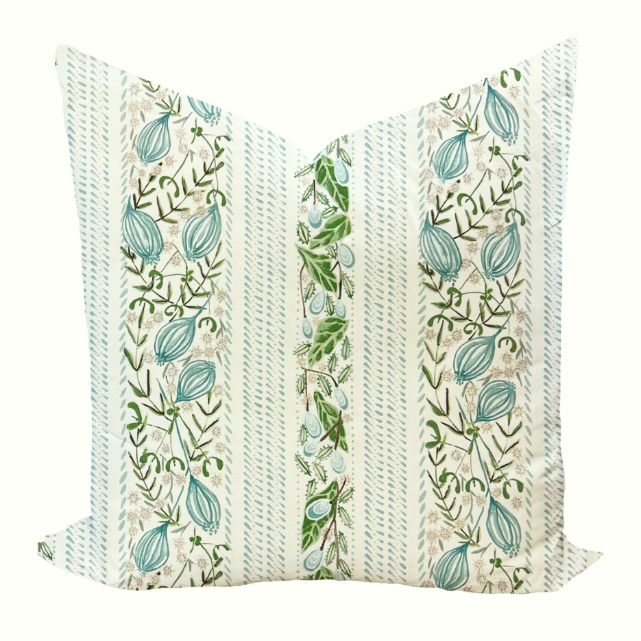 Decorative pillow with floral pattern on a white background