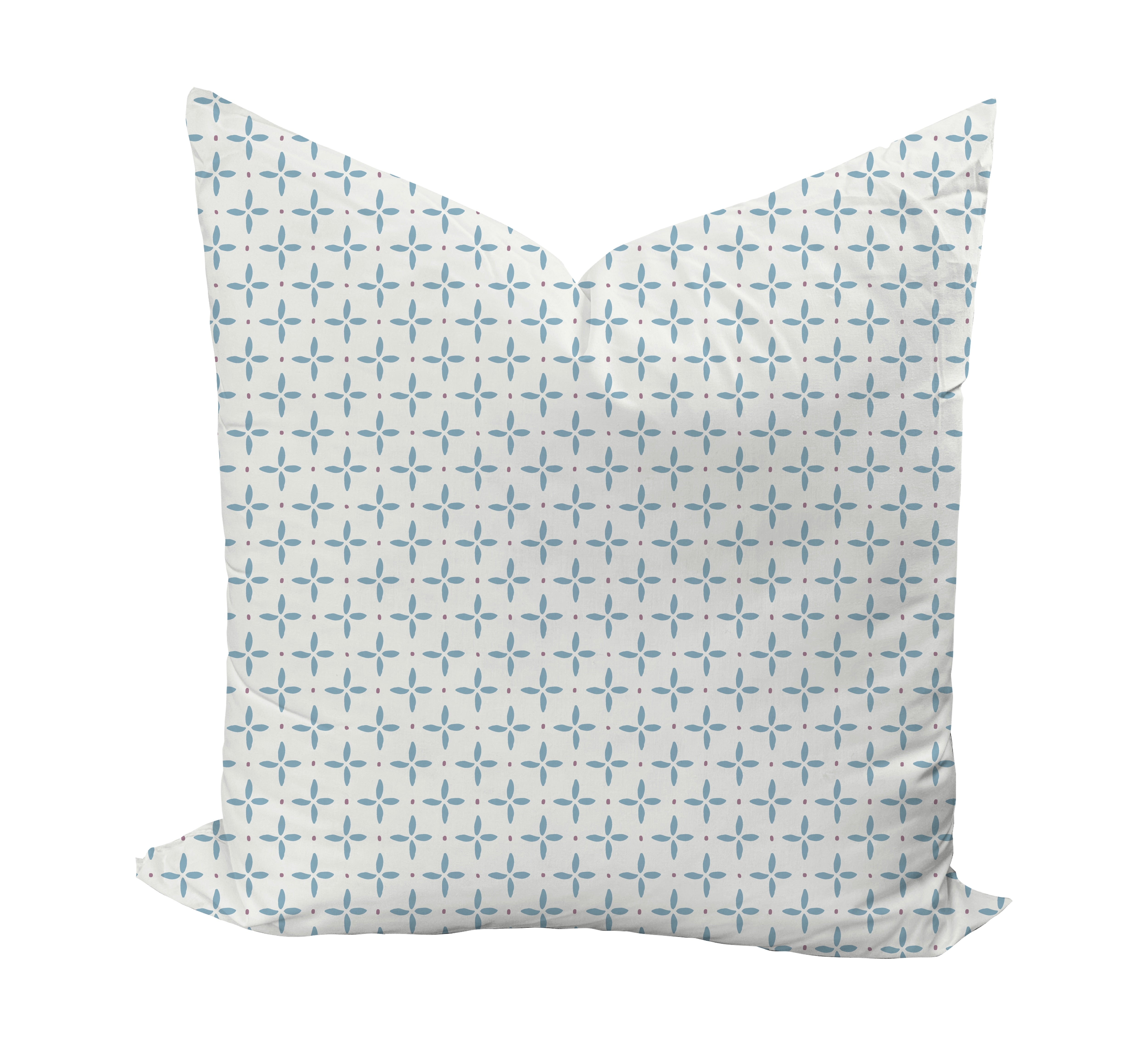 Decorative pillow with a geometric pattern in blue and purple on a white background