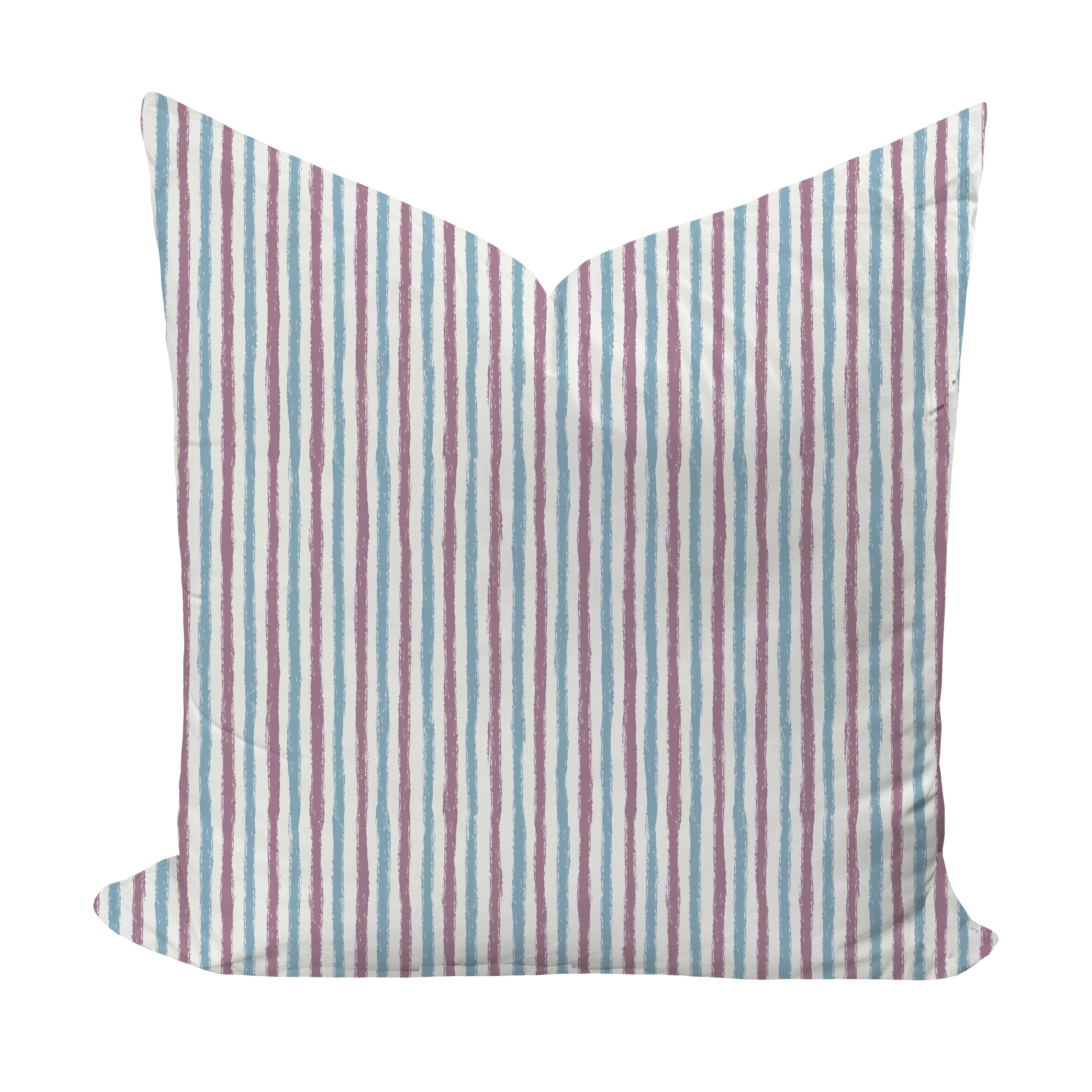 Striped pillow with purple and blue pattern on a white background