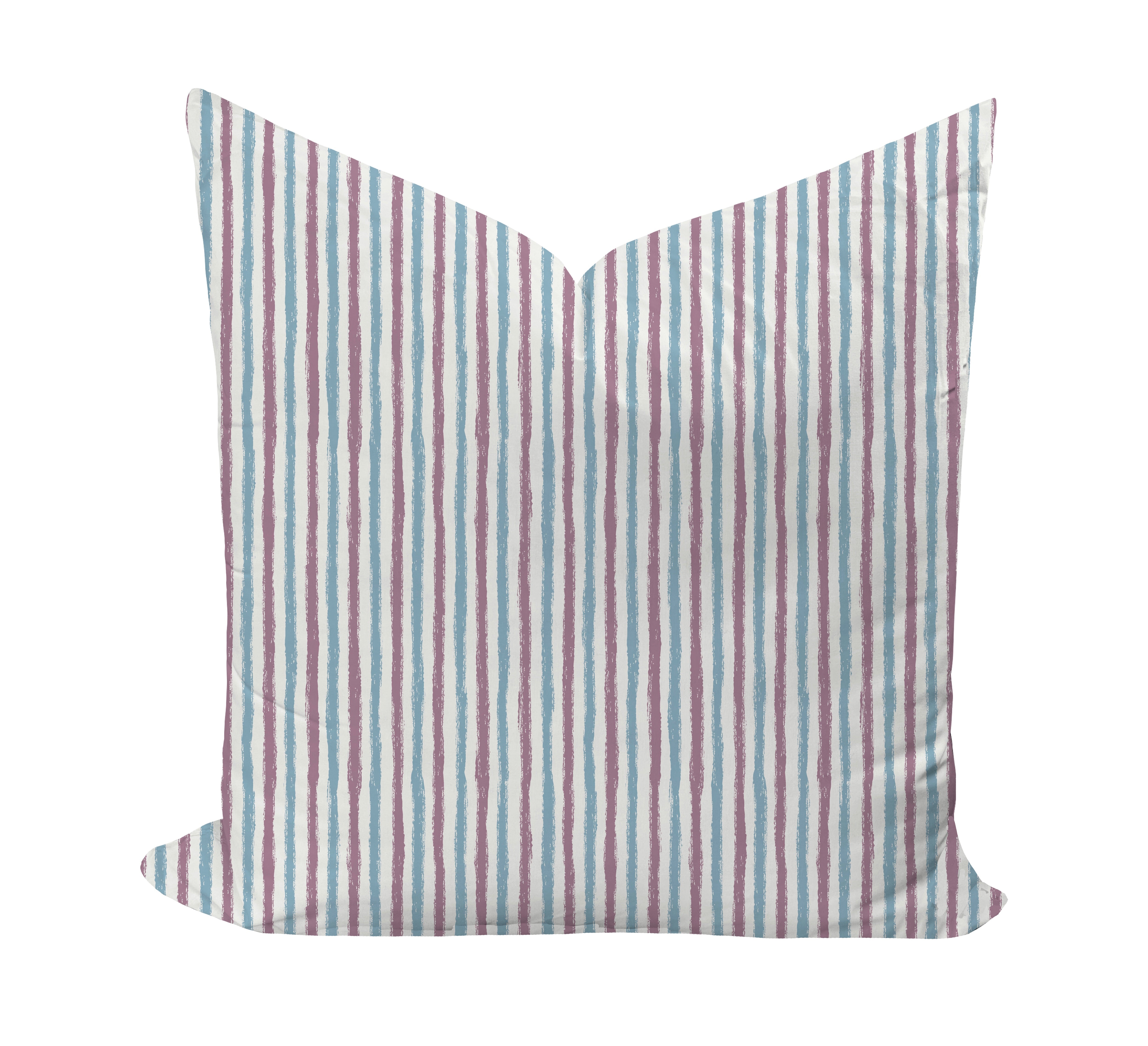 Striped pillow with purple and blue pattern on a white background