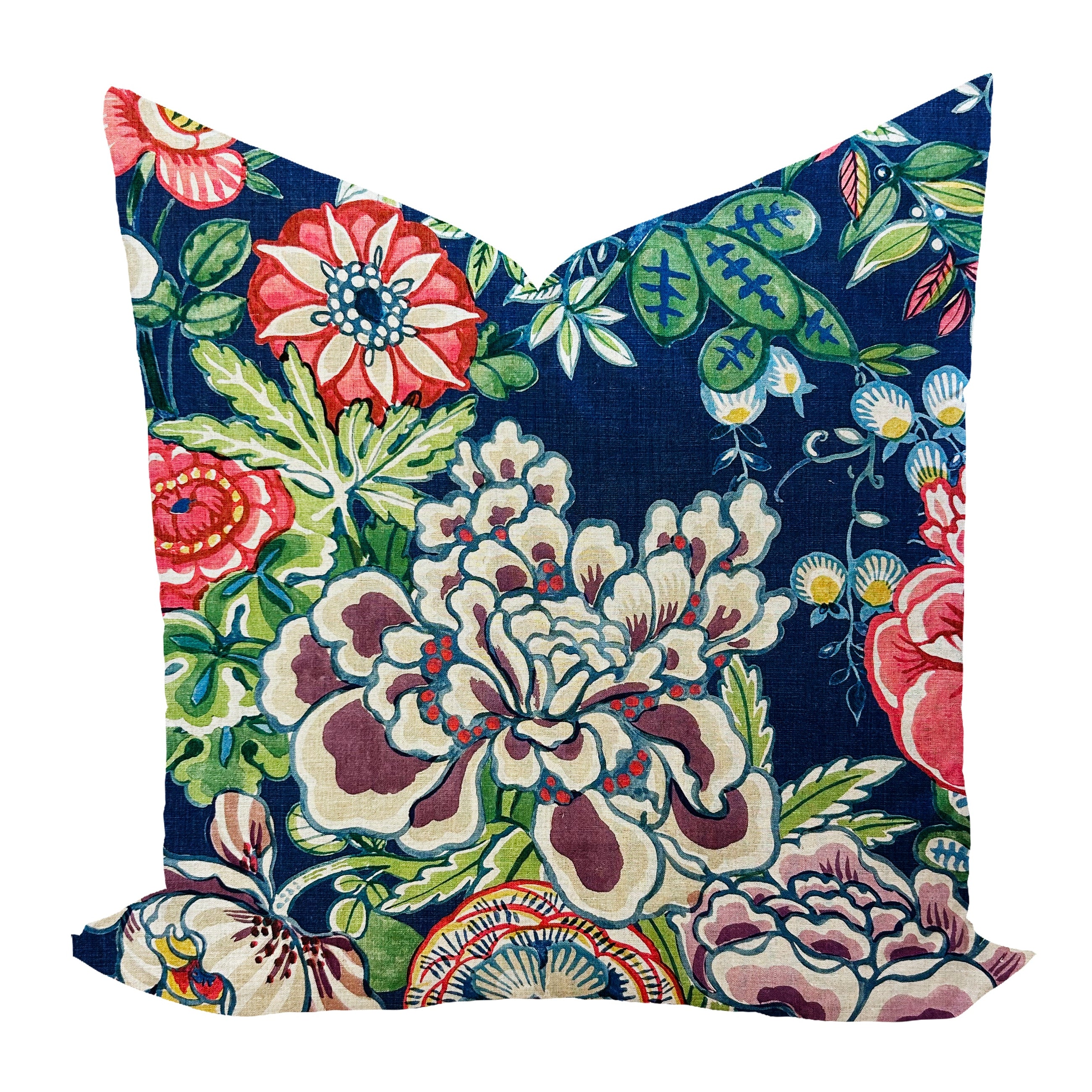 Floral-patterned pillow with vibrant colors on a navy fabric background
