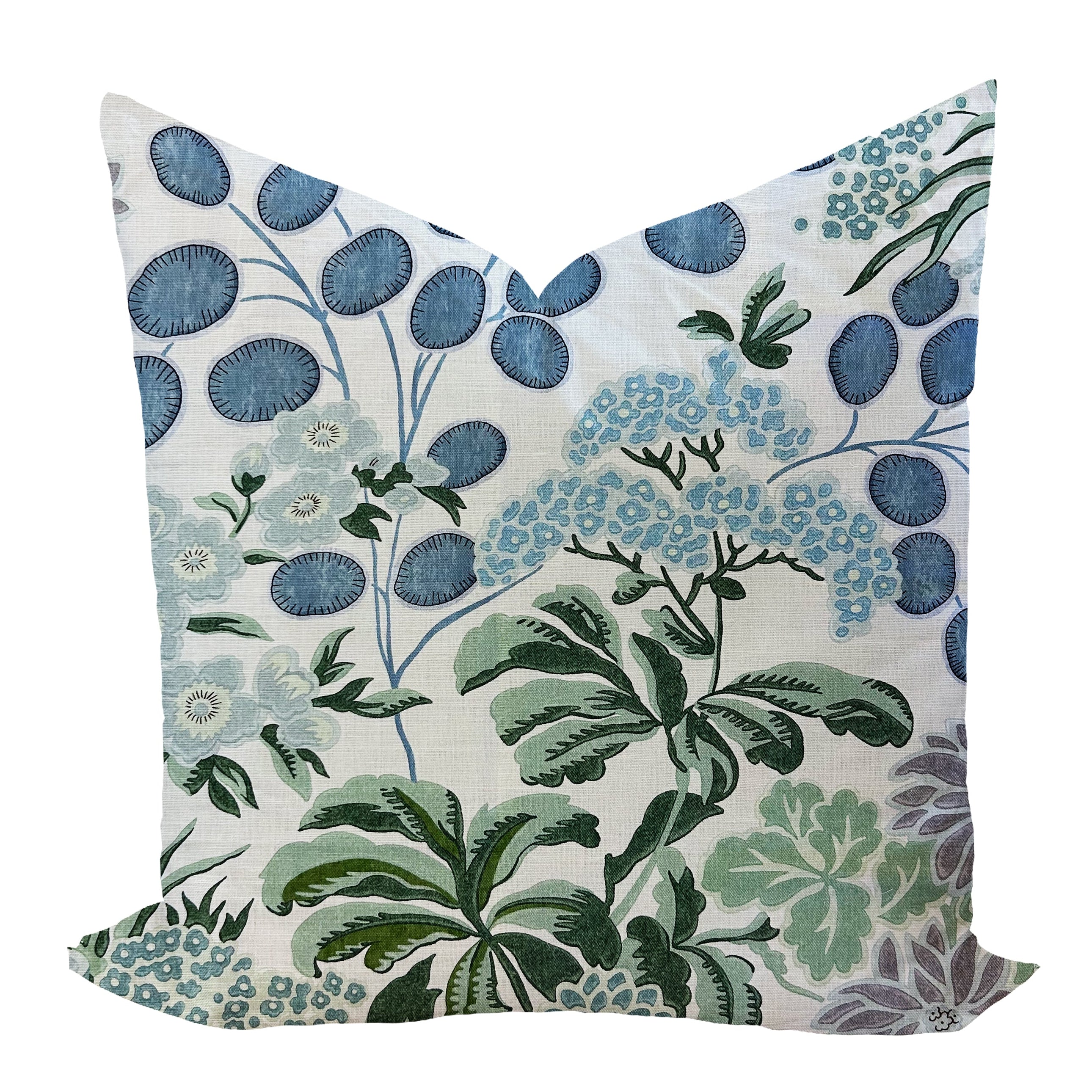 Floral patterned pillow with blue and green colors on a white background