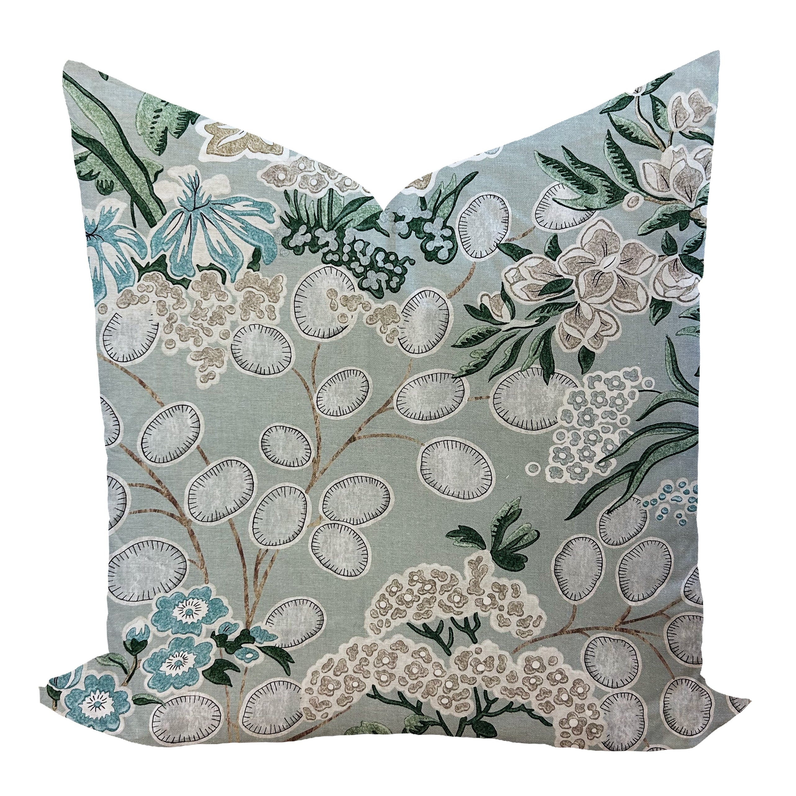 Floral patterned pillow on a sage green background