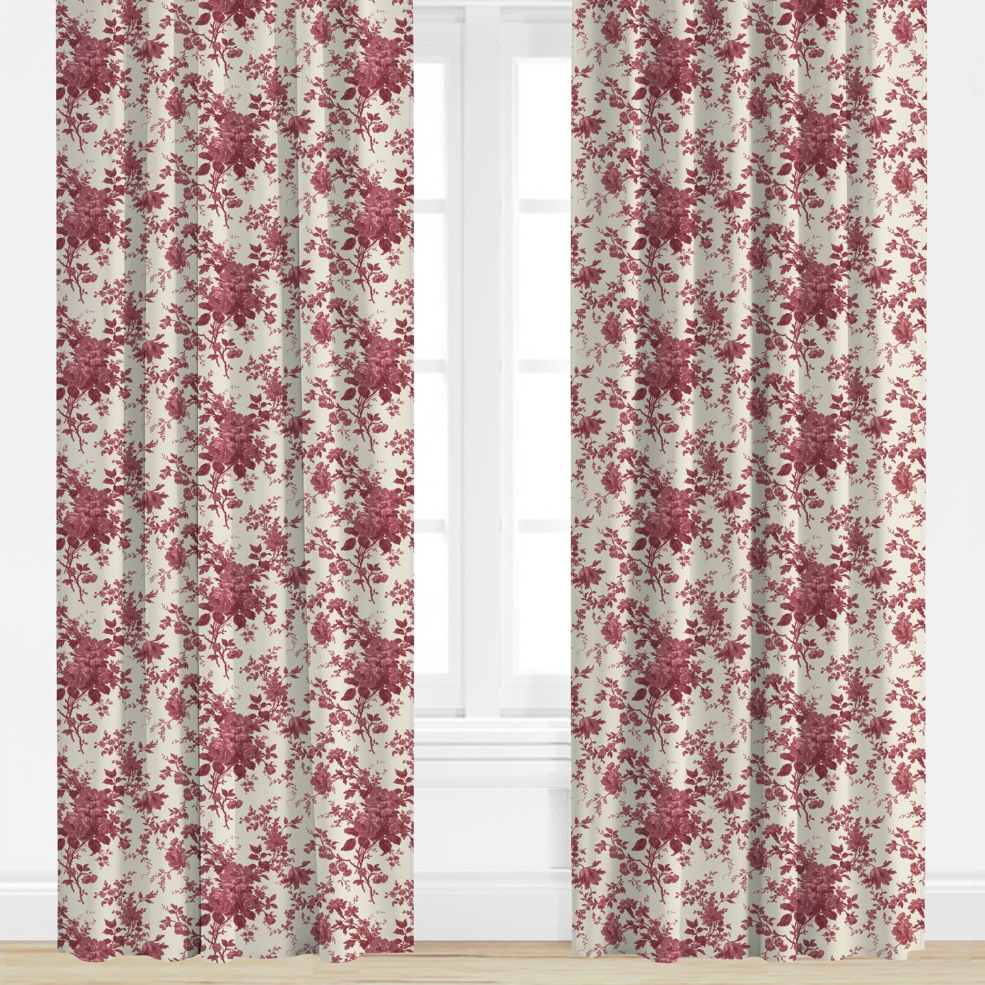 Floral patterned curtains in pink on a window with a white background