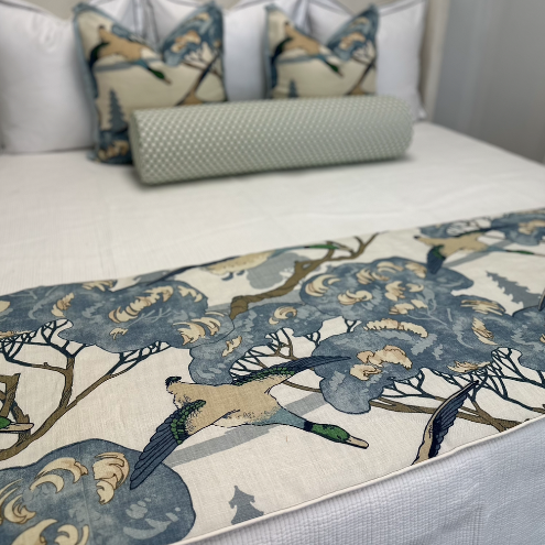 A bed footer with a flying ducks.