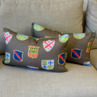 Decorative pillows with colorful patterns on a beige sofa.