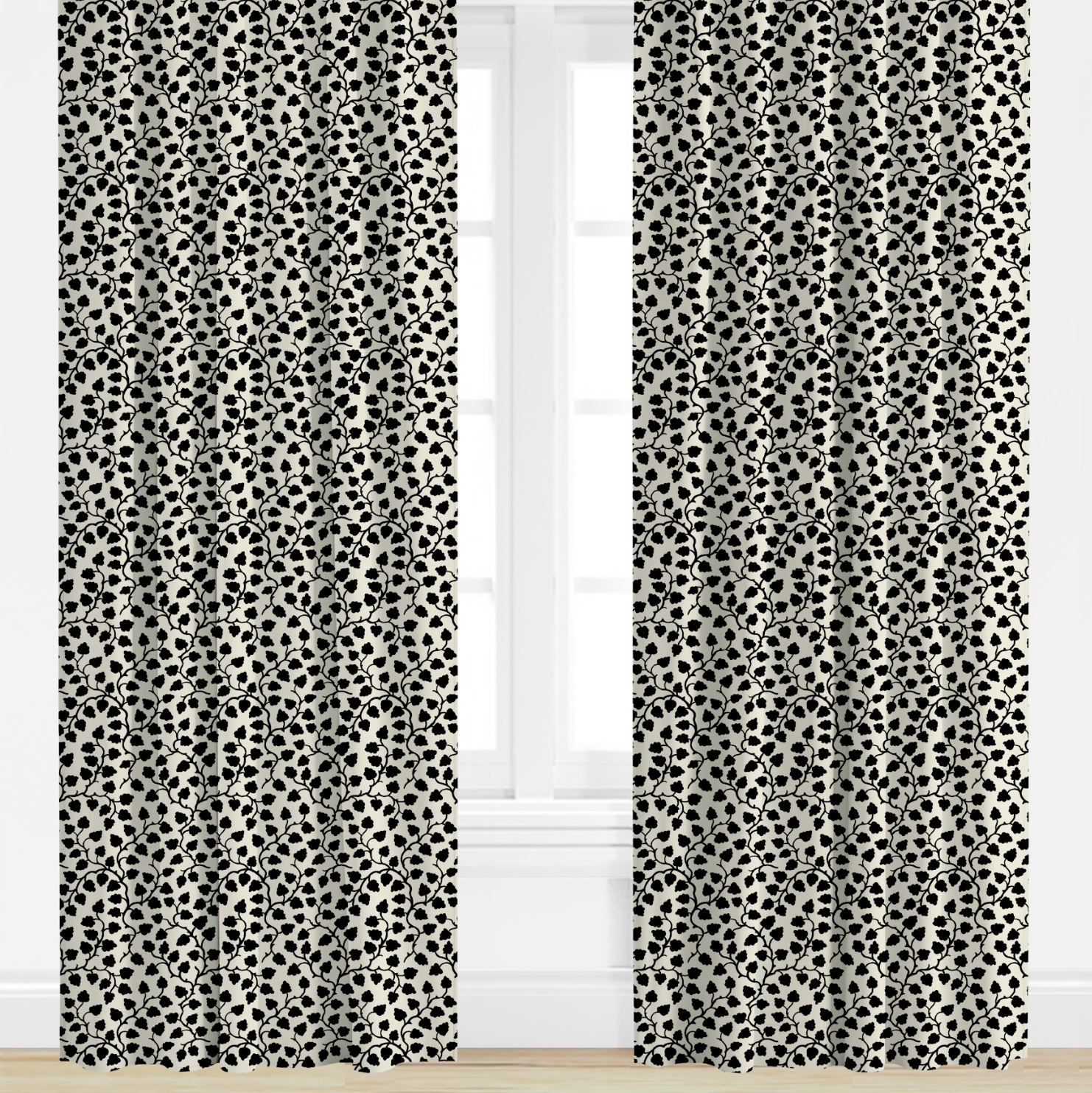 Black and white patterned curtains on a window with a white background