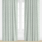 Blue Patterned curtains on a window with a white background