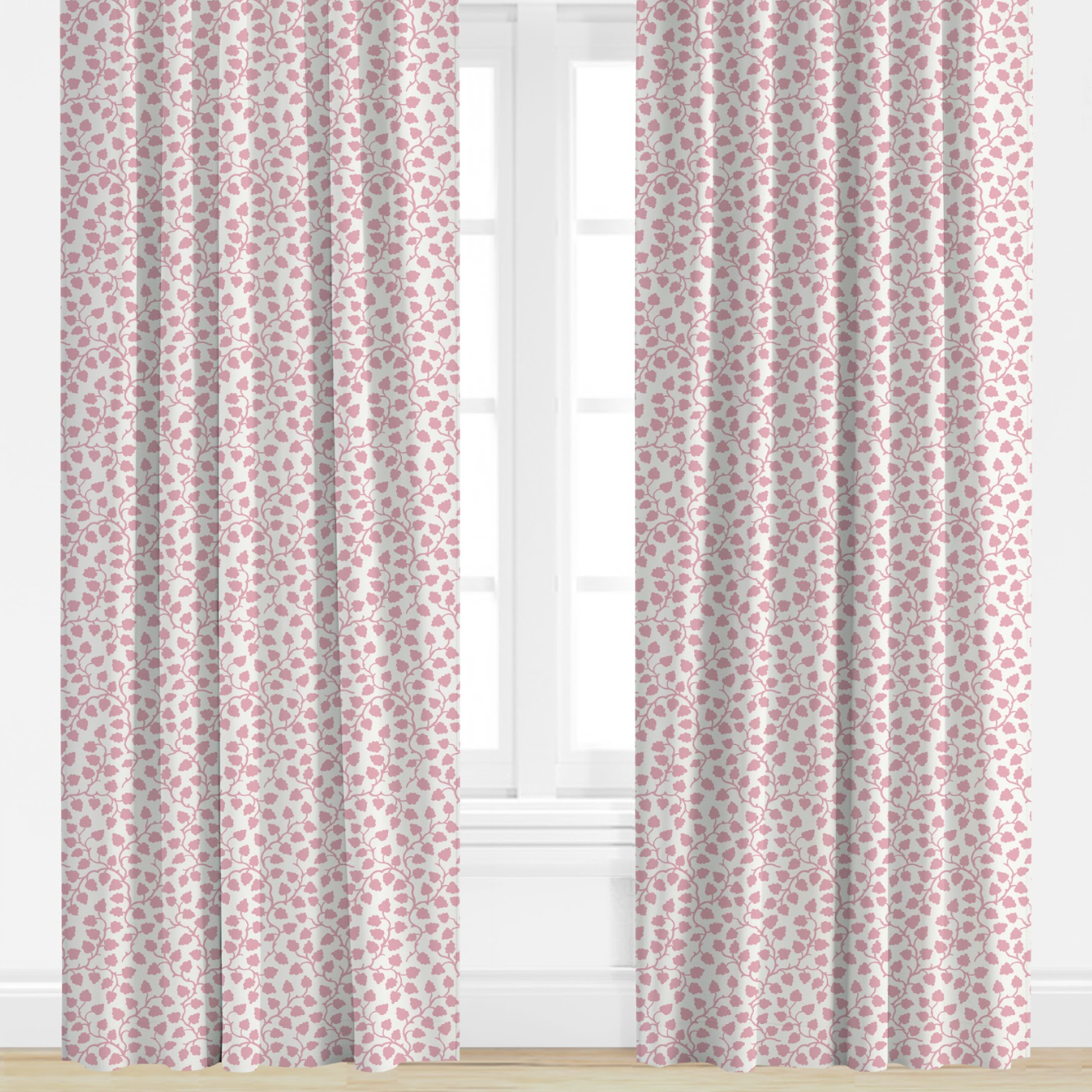 Pair of pink patterned curtains in front of a window with a white background