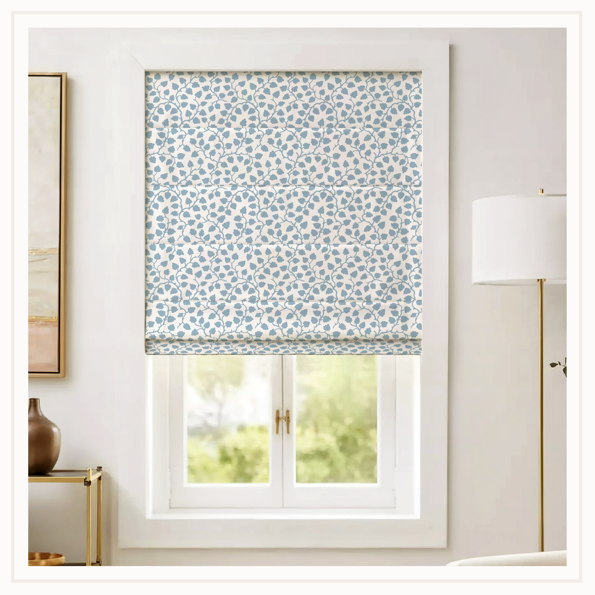 A light blue, vine patterned roman shade