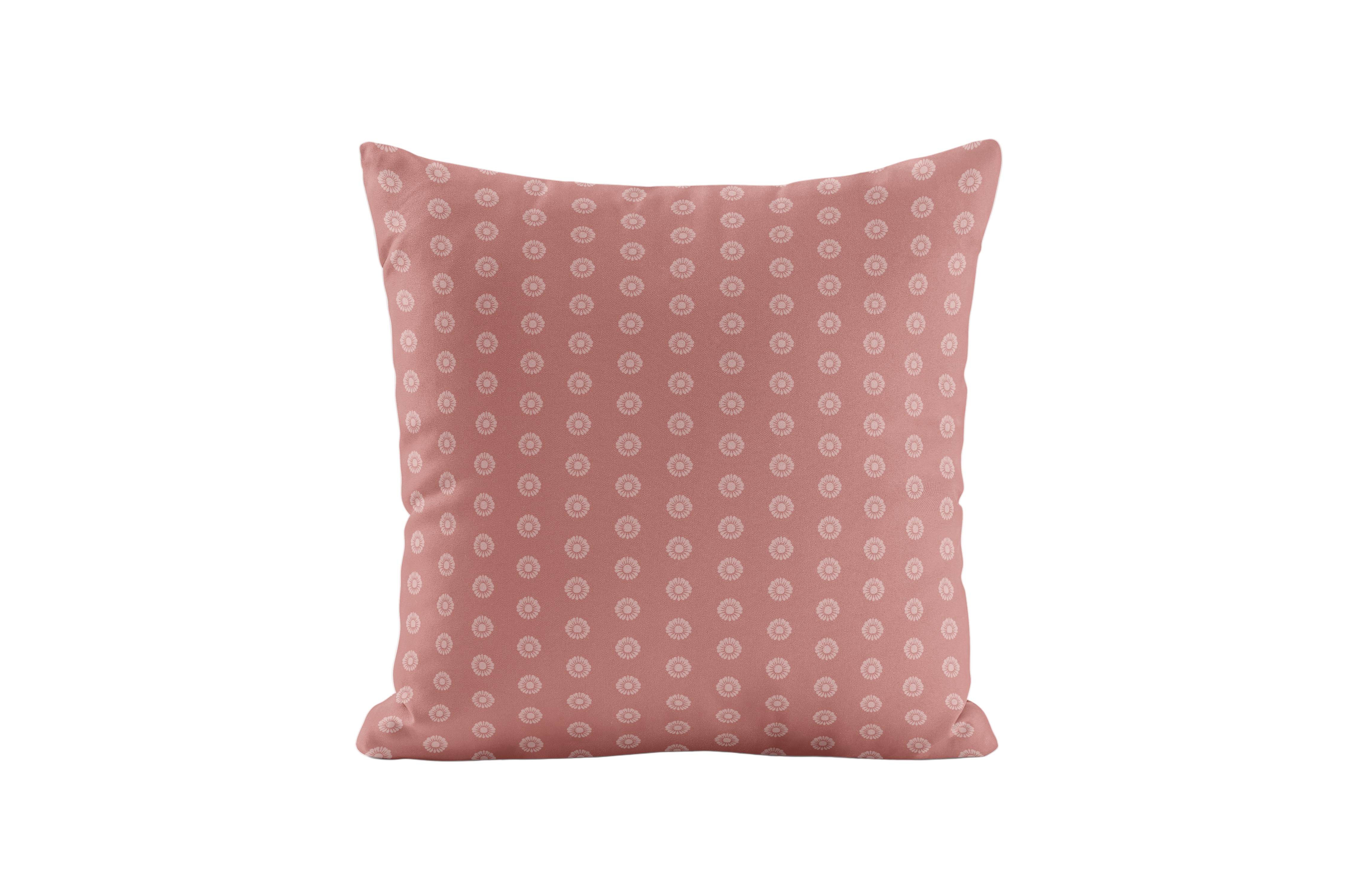 Pink pillow with a subtle dotted pattern on a white background