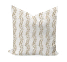 Decorative pillow with tan leaf pattern on a white background