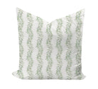 Decorative pillow with green leaf pattern on a white background