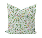 Floral patterned pillow with birds and butterflise in blue, green and pink by Camilla Moss