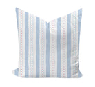 Striped pillow with blue and red pattern on a white background