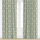 Green and blue butterfly and bird patterned drapes by Camilla Moss