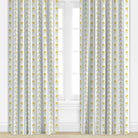 Curtains with a blue and yellow floral pattern on a white background