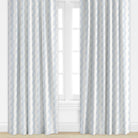 Blue patterned drapes by Camilla Moss