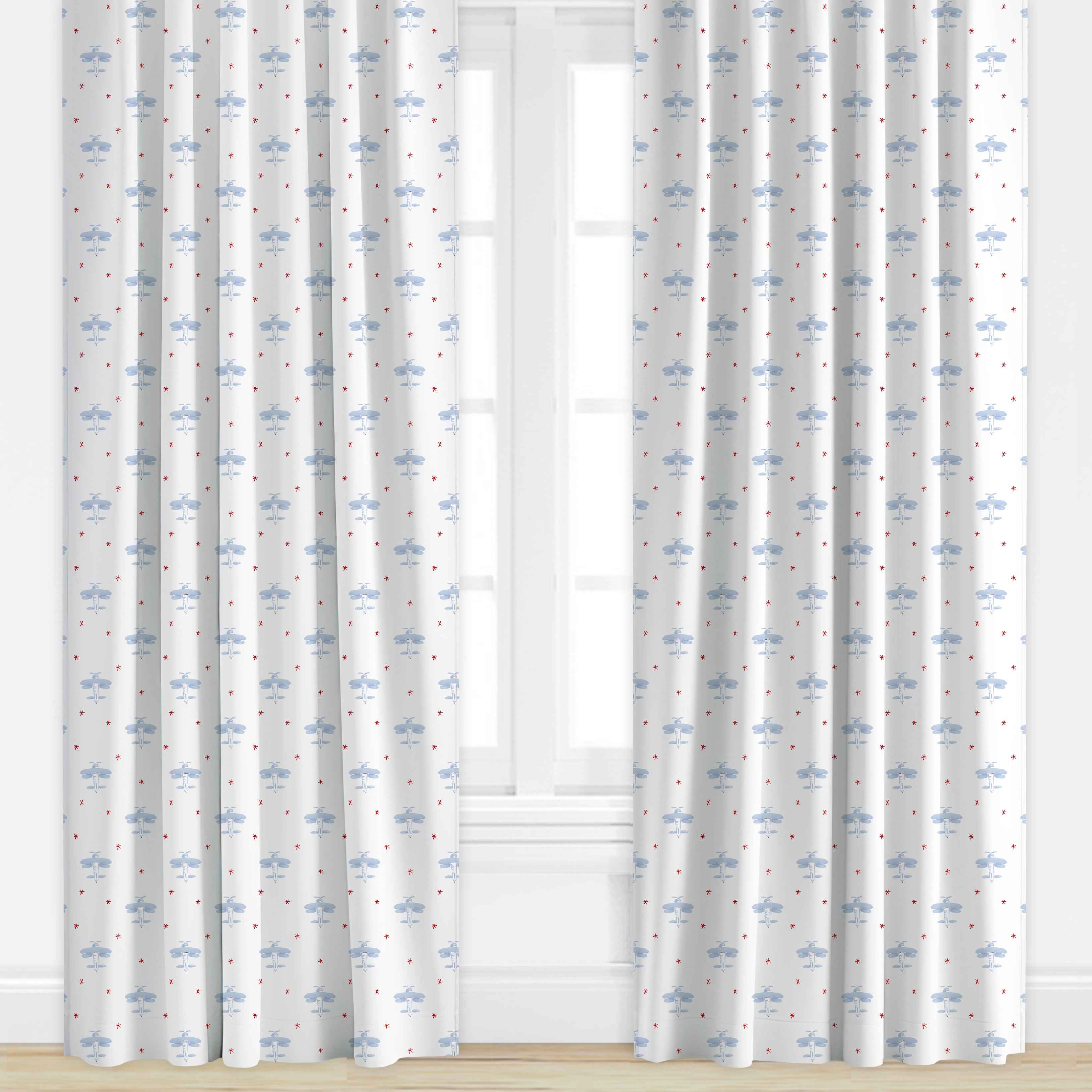 Airplane patterned drapes in blue and red by Camilla Moss