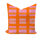Geometric patterned pillow in orange and pink