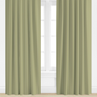 Pair of green striped curtains on a white window frame