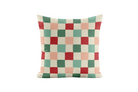 Checkered pillow with red, green, and beige squares on a white background