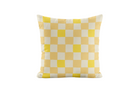 Yellow and white checkered pillow on a light gray background