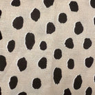 Dotted fabric in beige and black