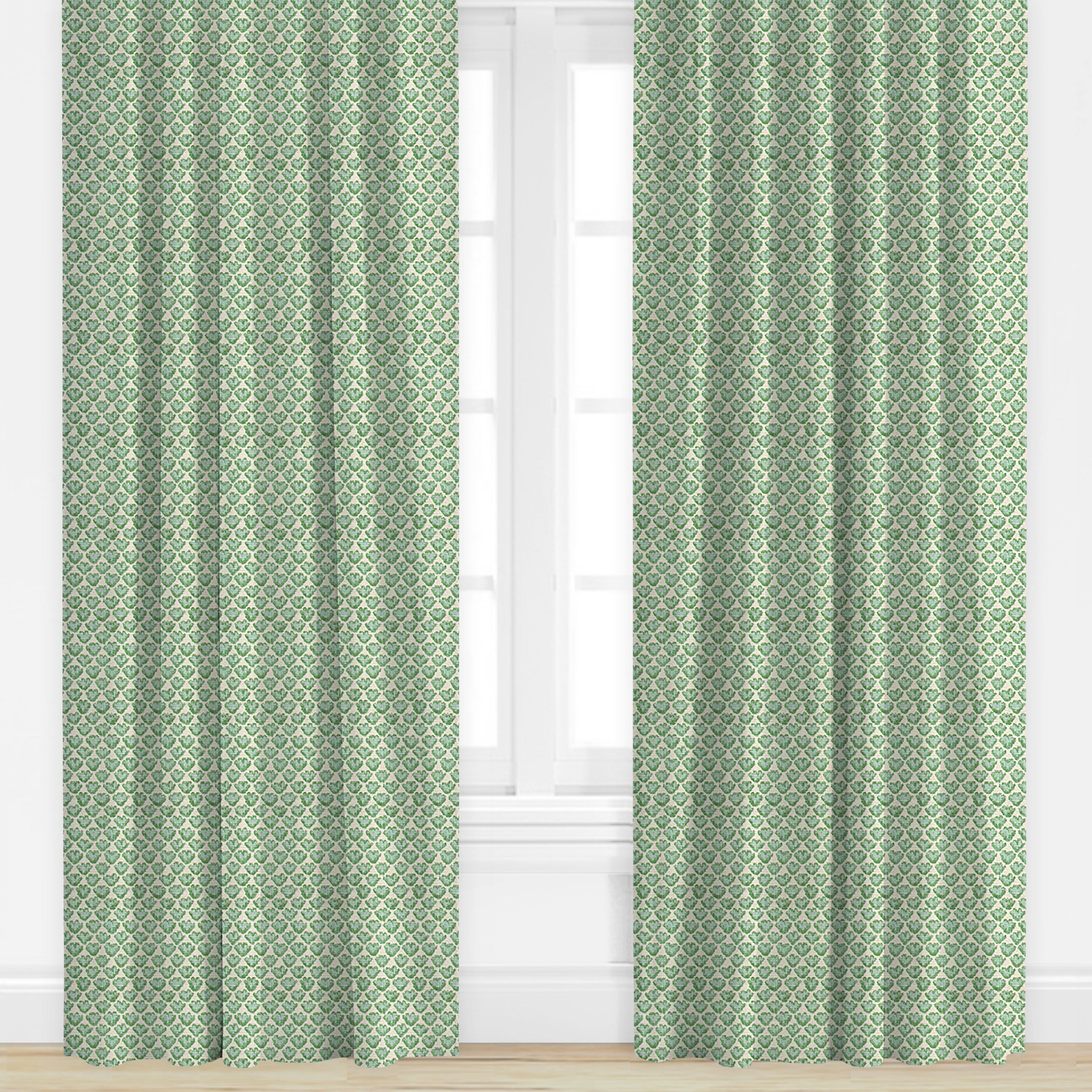 Green patterned curtains on a white window frame