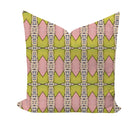Decorative pillow with pink and green geometric pattern on a white background