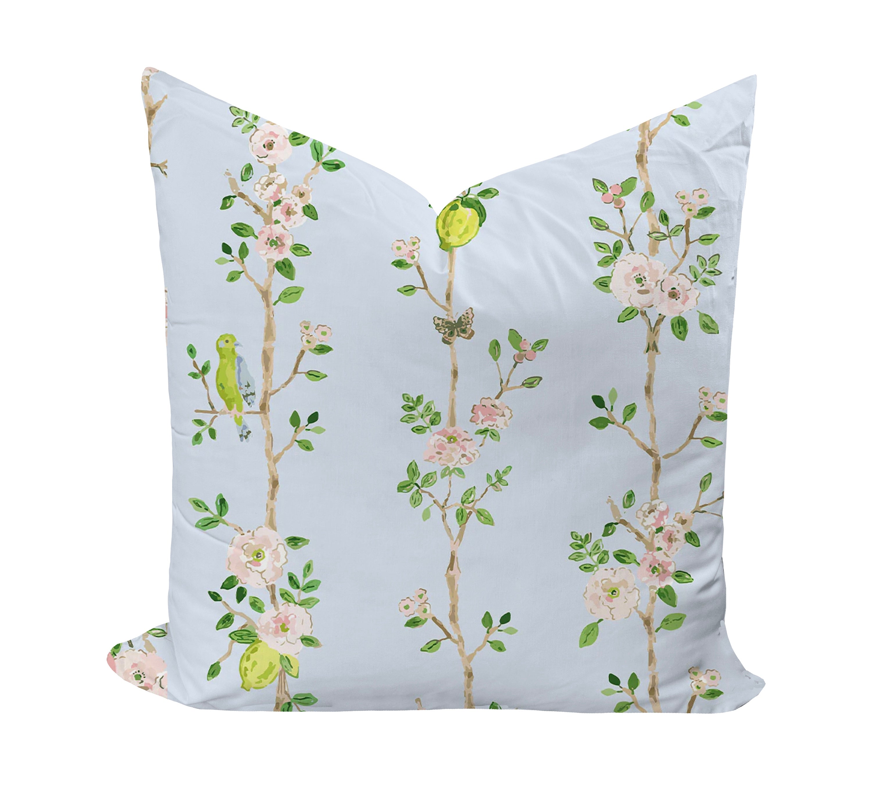 Decorative pillow with floral and bird pattern on a light blue background