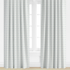 Blue Diamond Patterned curtains on a window with a light background