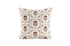Decorative pillow with black and brown floral pattern on a plain background