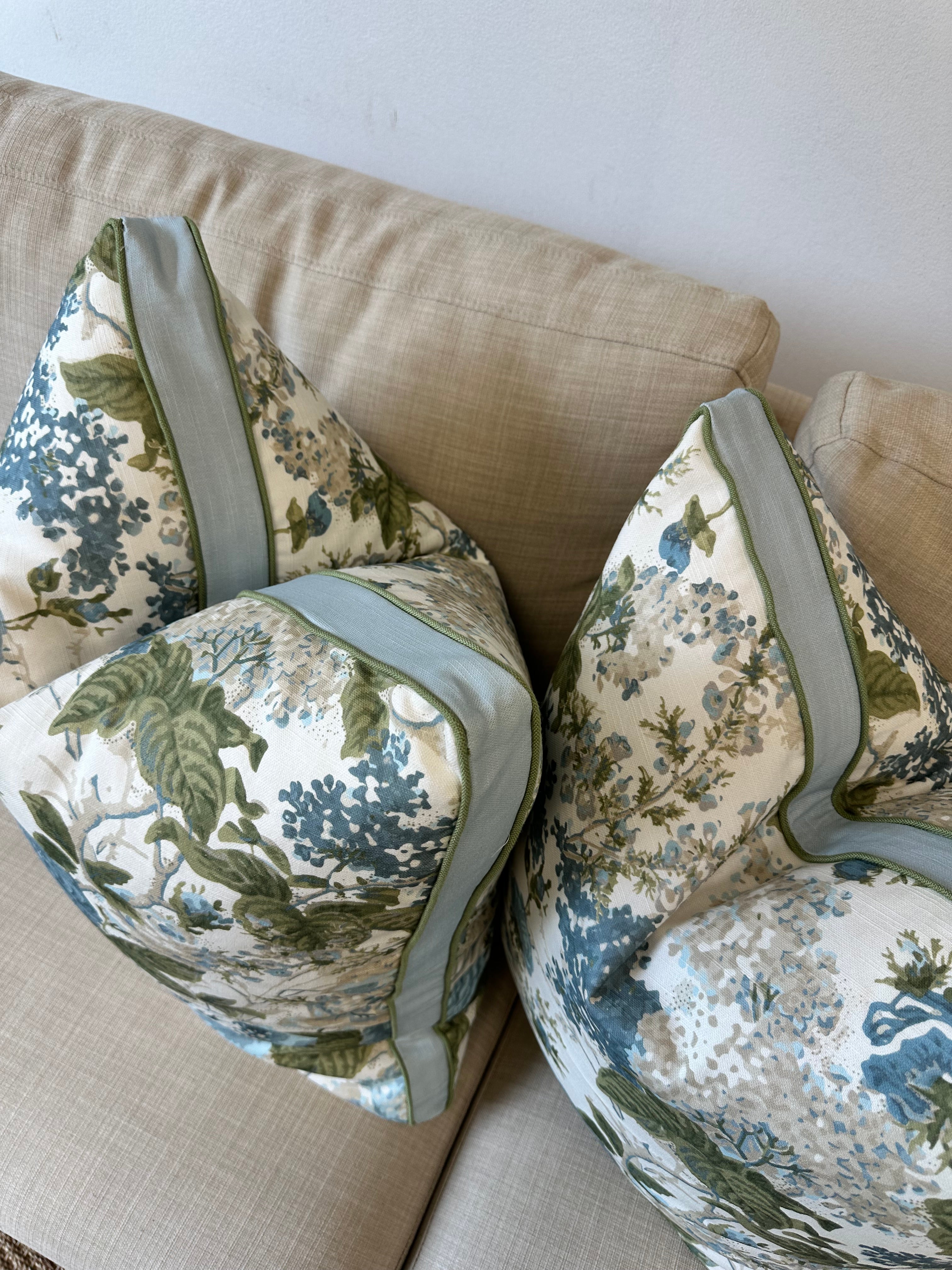 Floral-patterned pillows on a beige sofa