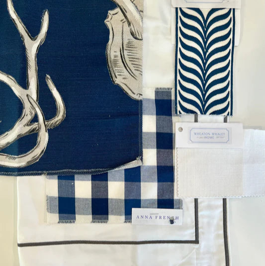 Collection of blue and white patterned fabric swatches with visible brand labels.