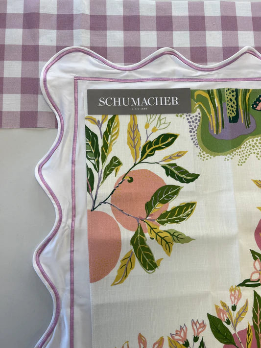 Schumacher fabric swatch with floral design on a checkered background