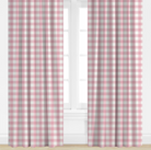 Pink and white checkered curtains on a window with a white background