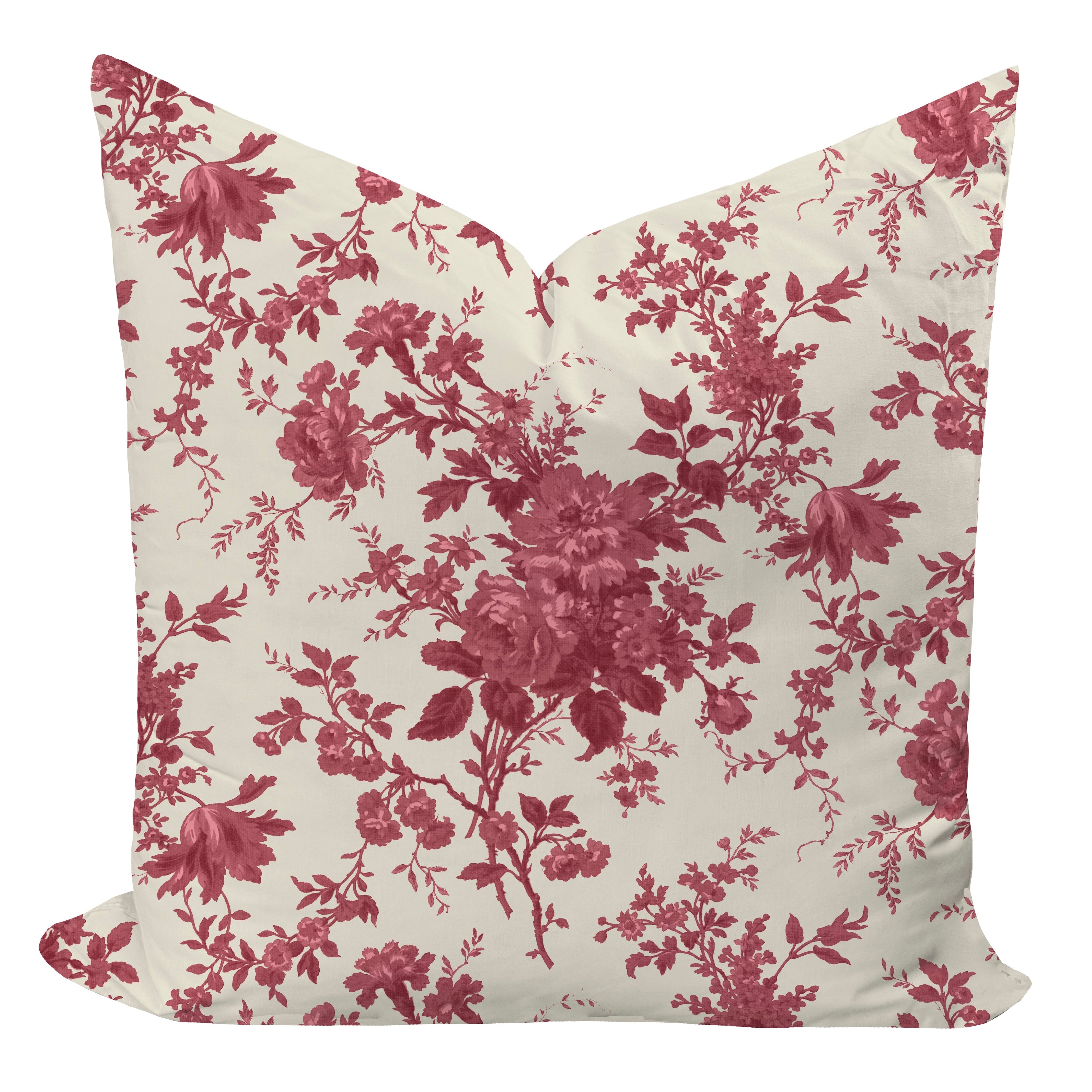 Floral patterned pillow with pink flowers on a white background