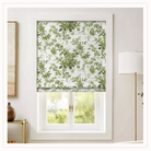 Floral patterned roman shade in green