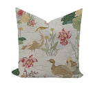 Decorative pillow with floral and bird pattern on a white background
