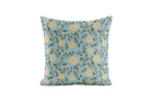 Decorative pillow with yellow floral pattern on a light blue background